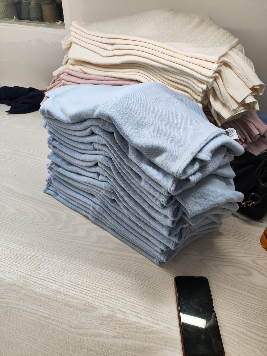 Folded knitwear stacked for packing